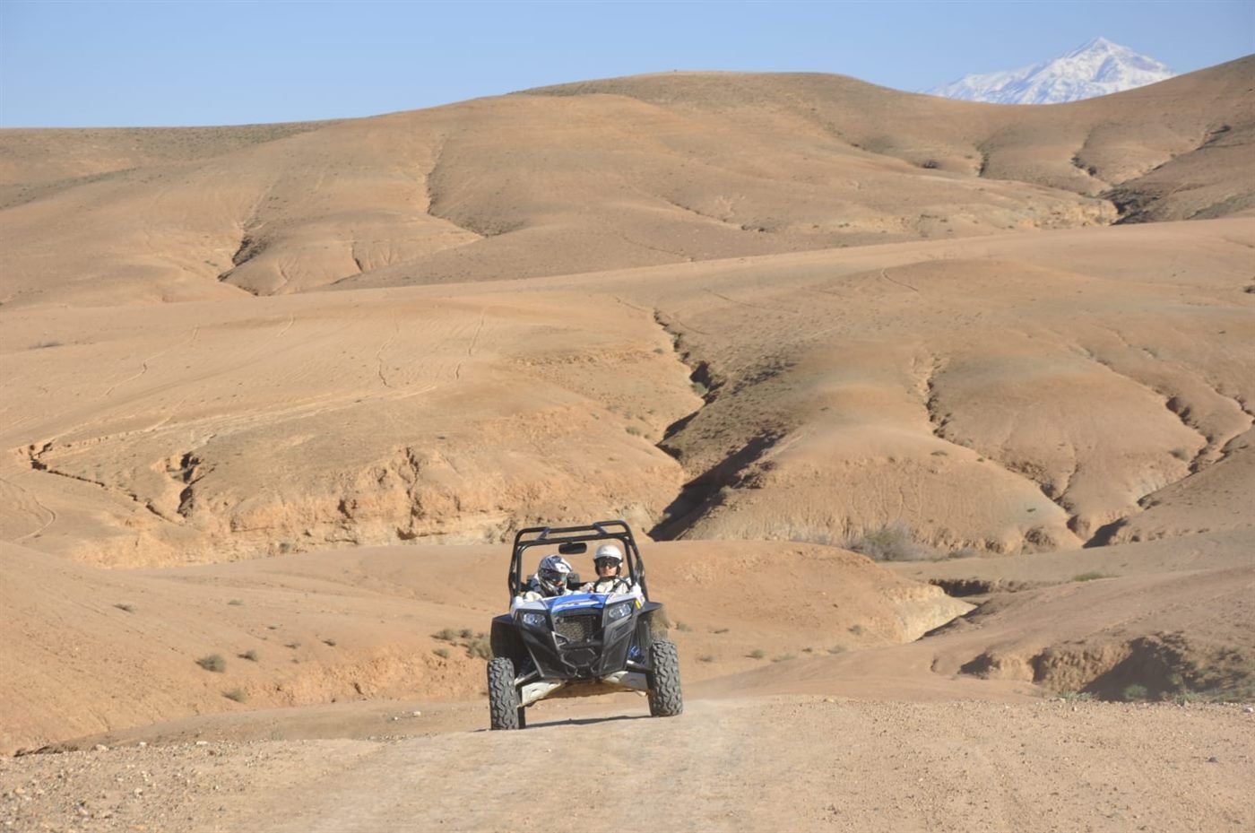 Buggy crossing the Agafay desert with the Atlas Mountains near Marrakech