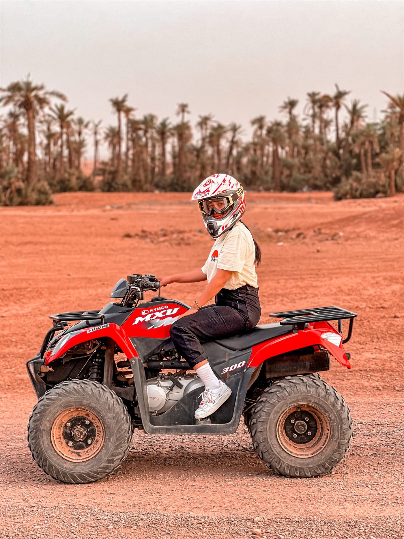 Rider on a red quad bike in the Marrakech Palmeraie
